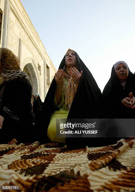 Iraqi Sunni Muslim women perform the Eid Al-Fitr morning prayers at the Sheikh Abdul Qadir al-Jilani mosque in central Baghdad on September 30, 2008....