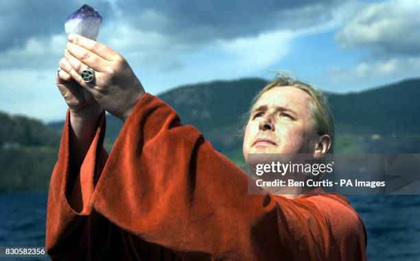 The High Priest of British White Witches Kevin Carlyon, from Hastings, East Sussex, casts a spell from a boat on the waters of Loch Ness to protect...