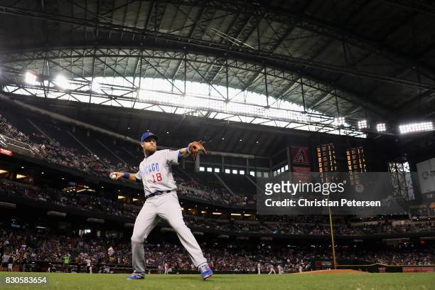 Infielder Ben Zobrist of the Chicago Cubs warms up on the field before the MLB game against the Arizona Diamondbacks at Chase Field on August 11,...