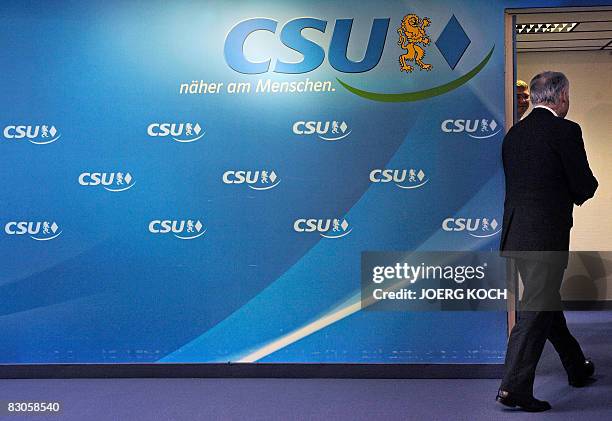 Chairman Erwin Huber leaves after announcing his resignation at a press conference in Munich on September 30 following a disastrous showing in...