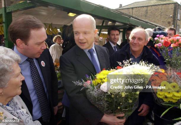 Conservative leader William Hague is barracked and jostled as he buys flowers for his wife Ffion during a visit to Pudsey near Leeds to support the...