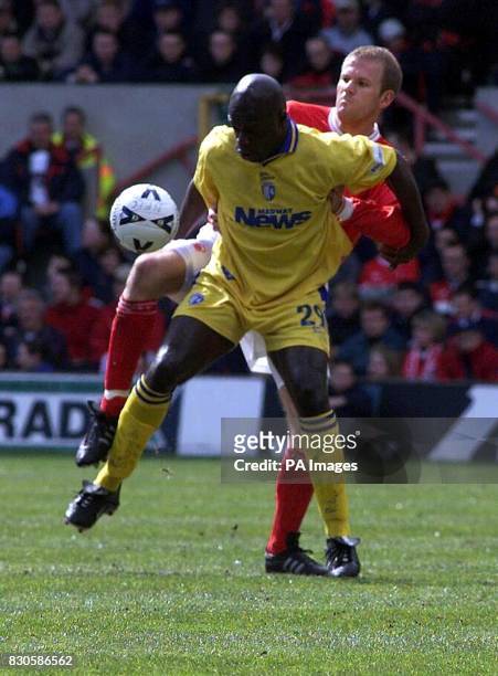 Nottingham Forest's Jon Olav Hjelde battles for the ball with Gillingham's Iffy Onuoura during the Nationwide Division One game at The City Ground,...