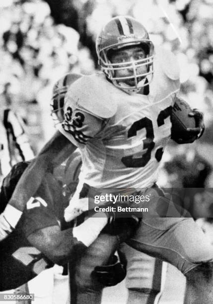 Roger Craig breaks a 26 yard run and is brought down by Rickey Dixon in the 3rd quarter action here 12/9 as the 49ers go on to defeat the Bengals...