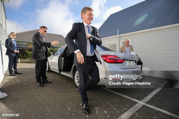 Prime Minister Bill English arrives in his crown car during the opening of a new Challenge 2000 premises on August 12, 2017 in Wellington, New...