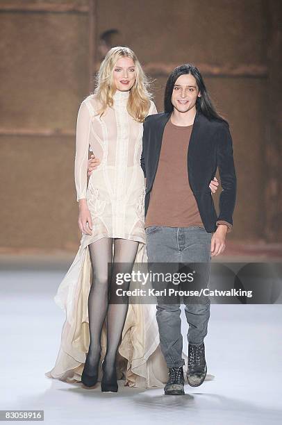 Designer Olivier Theyskens and a model walk the runway during the Nina Ricci show part of Paris Fashion Week Spring/Summer 2009 on September 28,2008...