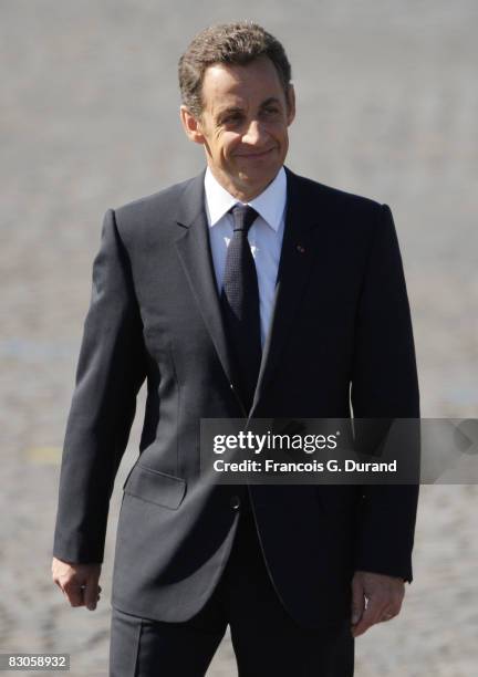 French President Nicolas Sarkozy arrives to attend the ceremony of the Bastille Day, on July 14, 2008 in Paris.