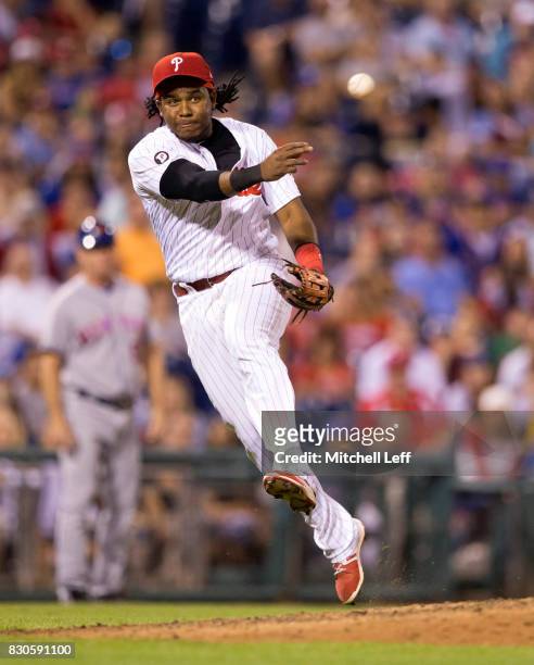 Maikel Franco of the Philadelphia Phillies throws out Michael Conforto of the New York Mets in the top of the ninth inning at Citizens Bank Park on...