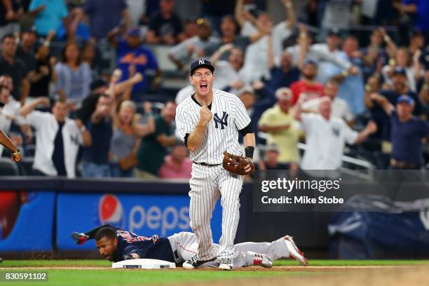 Todd Frazier of the New York Yankees pumps his fist after tagging out Eduardo Nunez of the Boston Red Sox for a double play in the ninth inning at...