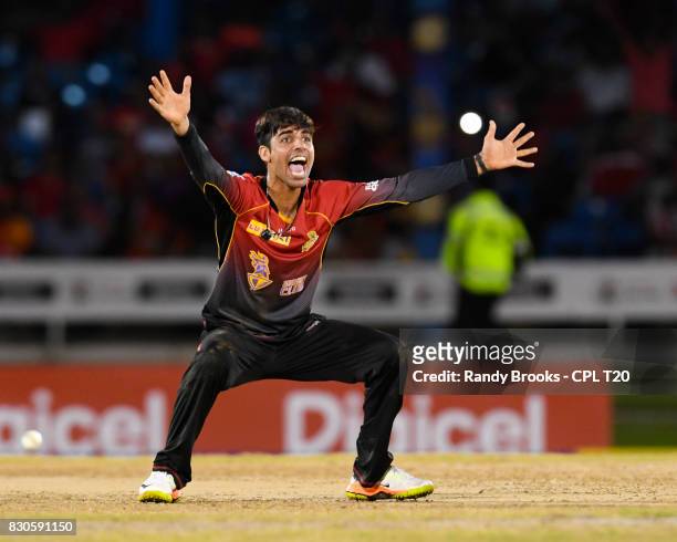 In this handout image provided by CPL T20, Shadab Khan of Trinbago Knight Riders celebrates taking 4 Guyana Amazon Warriorswicket for 28 runs during...