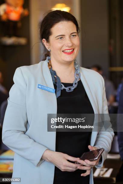 National's Wellington Central candidate Nicola Willis looks on before taste testing the 'Bill English Burger' at The Backbencher gastropub on August...