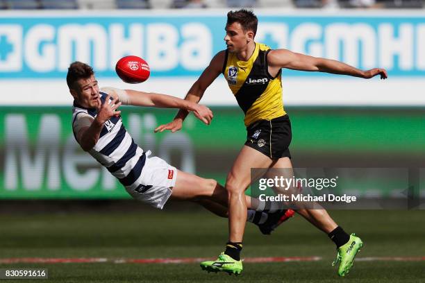 Tom Ruggles of Geelong and Sam Lloyd of Richmond compete for the ball during the round 16 VFL match between Geelong and Richmond at Simonds Stadium...