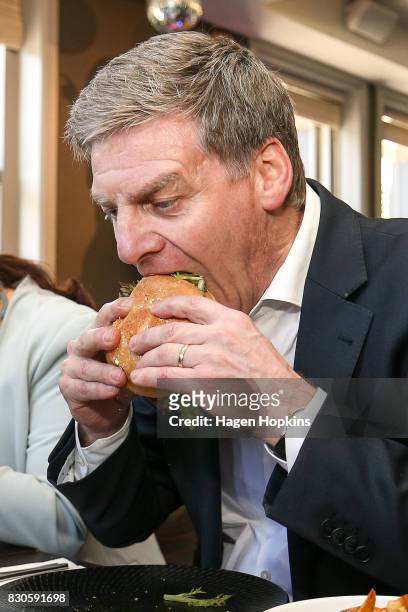 Prime Minister Bill English taste tests the 'Bill English Burger' at The Backbencher gastropub on August 12, 2017 in Wellington, New Zealand. Prime...