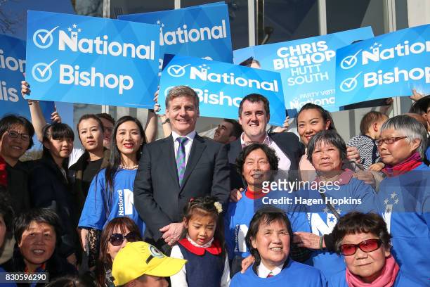 Prime Minister Bill English and Hutt South candidate Chris Bishop pose with supporters during a policy announcement at the Dowse Art Museum on August...