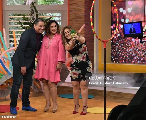 Daniel Sarcos and Carolina Sandoval attends the "Un Nuevo Dia" Celebrates Angelica Vale's Son's Birthday at Telemundo Studio on August 11, 2017 in...