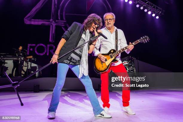 Kelly Hansen and Mick Jones of the band Foreigner perform during their 40th Anniversary Tour at DTE Energy Music Theater on August 11, 2017 in...