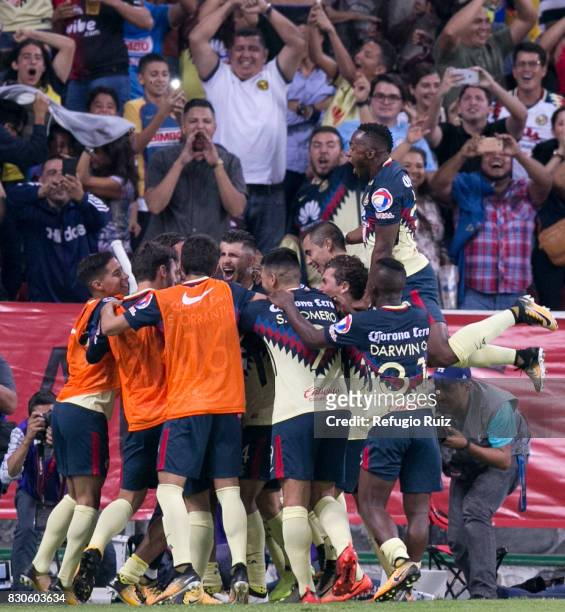 Oribe Peralta of America celebrates with teammates after scoring the first goal of his team during the 4th round match between Atlas and America as...