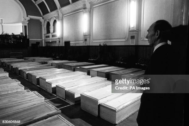 Rows of coffins of the victims of the Pan Am Boeing 747 bombing, in the makeshift chapel of rest in Lockerbie's town hall, 27th December 1988. A deal...