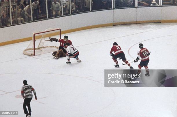 Bobby Nystrom of the New York Islanders scores the overtime goal past goalie Pete Peeters of the Philadelphia Flyers to win Game 6 of the 1980...