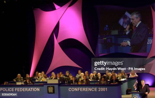 Home Secretary Jack Straw waves the Labour Party General Election manifesto as he delivers his speech to the Police Federation of England and Wales...