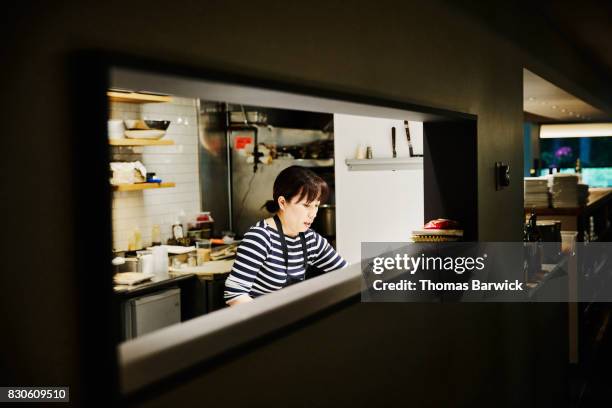 Female chef working in restaurant kitchen