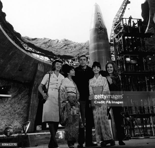 Ready to erupt into his new adventure, James Bond is pictured with other cast members inside the mighty volcano built at Pinewood Studios for the...