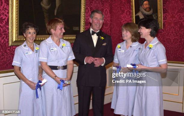 Prince Charles presents Marie Curie nurse of the year awards to Hazel Graham, Dawn Desbois, Anne Coyle and Catherine Le Roy at St. James' Palace,...