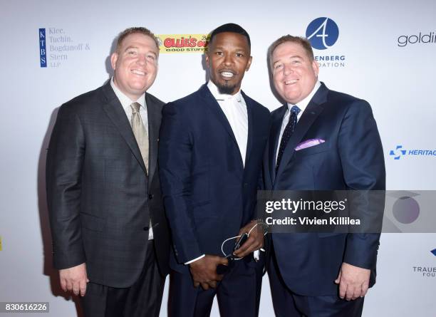 Dana Pump, Jamie Foxx and David Pump attend the 17th Annual Harold & Carole Pump Foundation Gala at The Beverly Hilton Hotel on August 11, 2017 in...