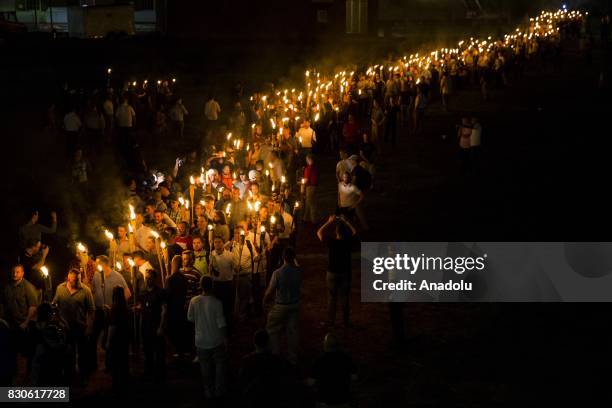 Neo Nazis, Alt-Right, and White Supremacists march through the University of Virginia Campus with torches in Charlottesville, Va., USA on August 11,...