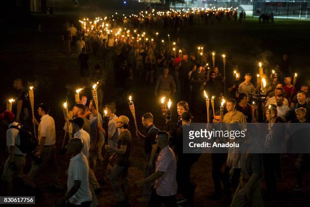 Neo Nazis, Alt-Right, and White Supremacists march through the University of Virginia Campus with torches in Charlottesville, Va., USA on August 11,...