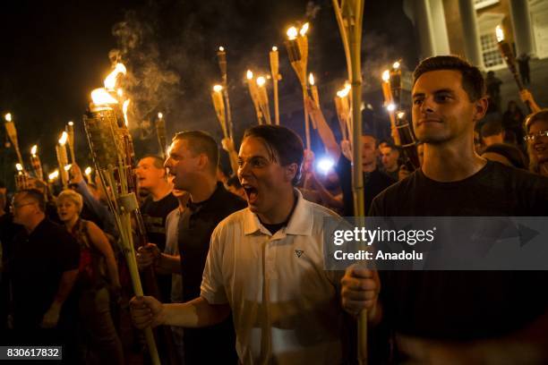 Peter Cvjetanovic along with Neo Nazis, Alt-Right, and White Supremacists encircle and chant at counter protestors at the base of a statue of Thomas...