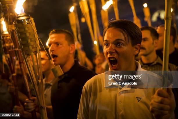 Peter Cvjetanovic along with Neo Nazis, Alt-Right, and White Supremacists encircle and chant at counter protestors at the base of a statue of Thomas...