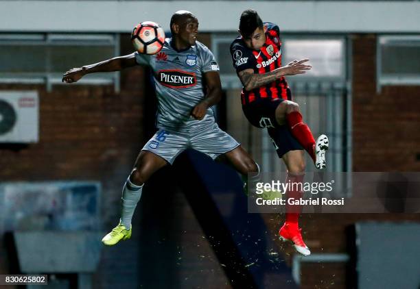 Victor Salazar of San Lorenzo fights for the ball with Oscar Bagui of Emelec during a second leg match between San Lorenzo and Emelec as part of...