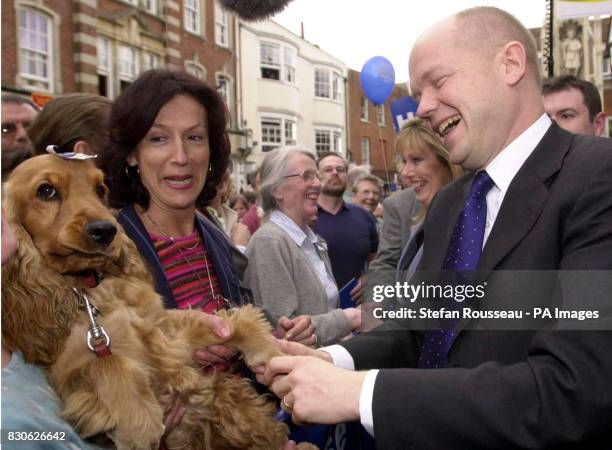 Conservative Party leader Willaim Hague meets Tiffin the dog and her owner, in Winchester, Hampshire, during a frenetic last day of campaigning with...