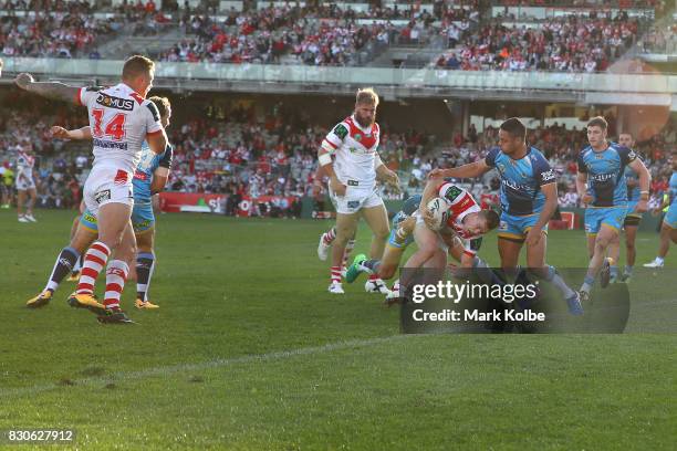 Cameron McInnes of the Dragons scoresa try during the round 23 NRL match between the St George Illawarra Dragons and the Gold Coast Titans at UOW...