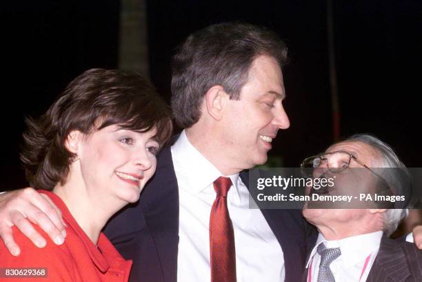 British Prime Minister Tony Blair gives his wife Cherie and father Leo a hug after being declared winner of the Sedgefield constiuency, at Newton...