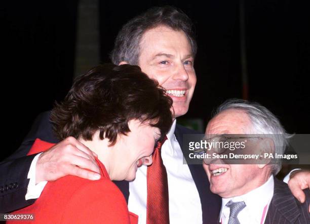 British Prime Minister Tony Blair gives his wife Cherie and father Leo a hug after being declared winner of the Sedgefield constiuency, at Newton...