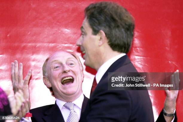British Prime Minister Tony Blair is greeted by former leader Neil Kinnock as he arrives at the Labour Party headquarters at Millbank in central...