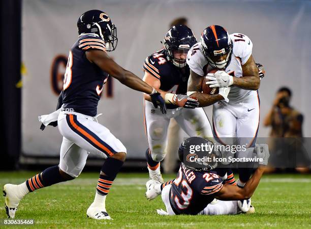 Denver Broncos wide receiver Cody Latimer is tackled by Chicago Bears cornerback Kyle Fuller during the preseason game between the Denver Broncos and...