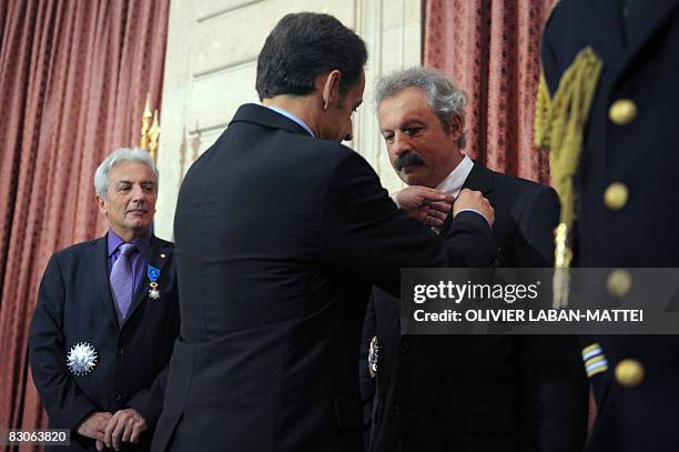 French President Nicolas Sarkozy awards French scientist and laureate of the 2007 Turing Award, Joseph Sifakis with the Grand Officier de l'Ordre...