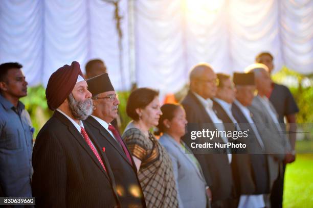 Manjeev Singh Puri, Ambassador of India to Nepal, former prime minister Puspa Kamal Dahal and other ministers and stands as the National anthem plays...