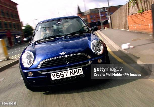 The new Williams BMW Mini drives around the streets of Manchester during the national launch for dealers of the revamped English Classic car 2001. *...