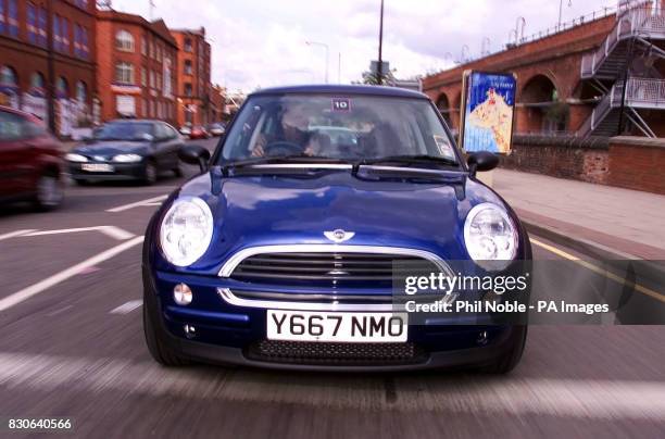 The new Williams BMW Mini drives around the streets of Manchester during the national launch for dealers of the revamped English Classic car 2001. *...