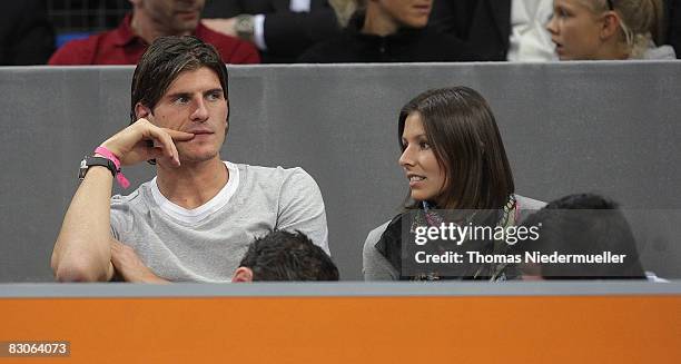 Mario Gomez of VfB Stuttgart is seen with his girlfriend Silvia Meichel during the Porsche Tennis Grand Prix at the Porsche Arena on September 30,...