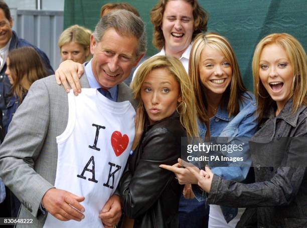 The Prince of Wales is presented with a T-shirt by pop group Atomic Kitten, Jenny Frost, Liz Maclarnon and Natasha Hamilton in London. Atomic Kitten,...