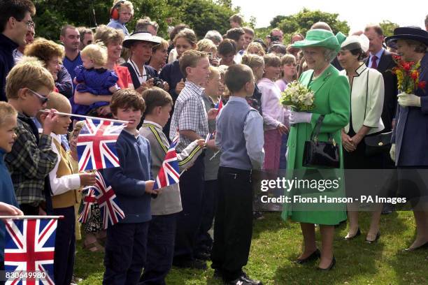 Britain's Queen Elizabeth II is greeted by locals on the island of Sark, on the first day of her two day visit to the Channel Islands