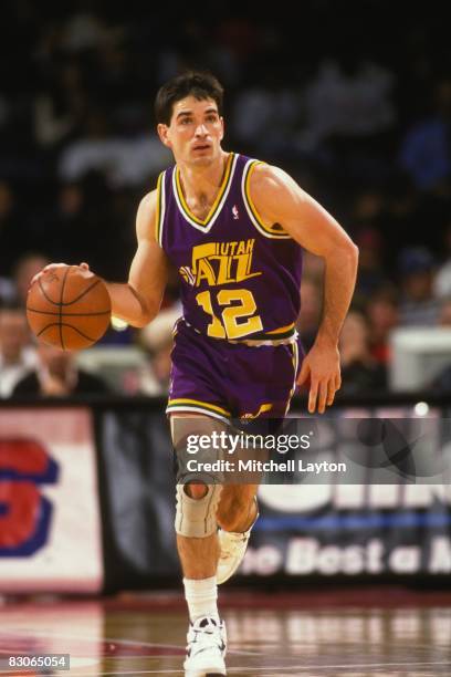 John Stockton of the Utah Jazz dribbles the ball up court during a NBA basketball game against the Washington Bullets at the U.S.Air Arena on...