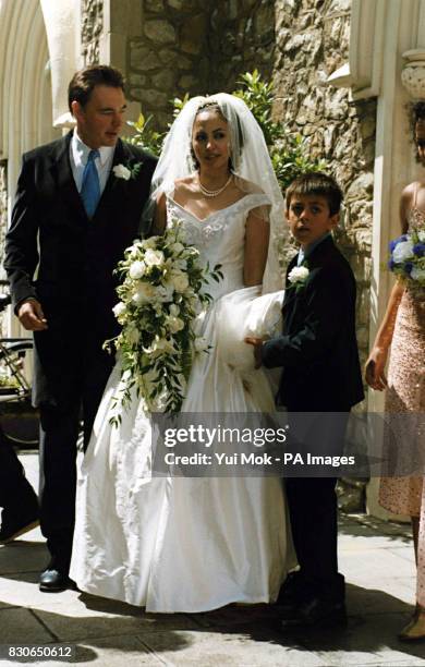 Julian Lloyd Webber and Kheira Bourahla at their wedding in Kensington, London. The 50-year cellist and brother of millionaire composer Andrew, was...