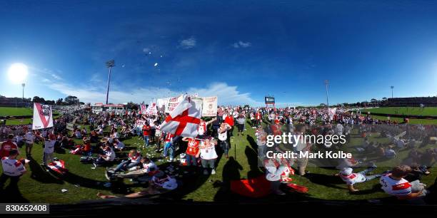 The supporters on the hill cheer as the Dragons take the field during the round 23 NRL match between the St George Illawarra Dragons and the Gold...