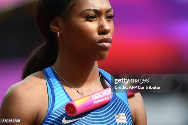 Athlete Aaliyah Brown prepares to run the first leg of their heat in the women's 4x100m relay athletics event at the 2017 IAAF World Championships at...