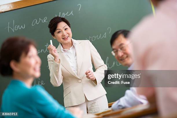 teacher in language class - tefl stock pictures, royalty-free photos & images